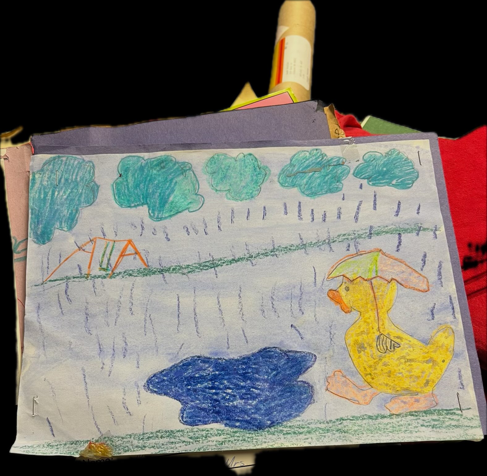 Grade-school crayon drawing of a duck with an umbrella in the rain